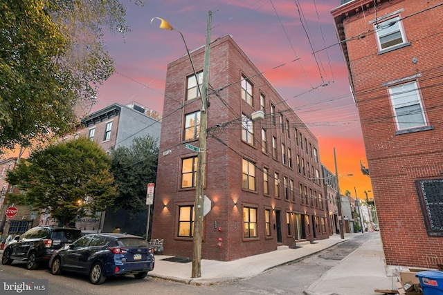 view of outdoor building at dusk