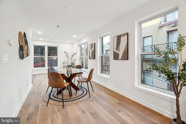 dining space with light wood-type flooring