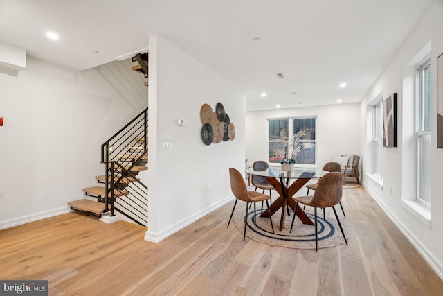 dining space featuring a wealth of natural light and light hardwood / wood-style floors