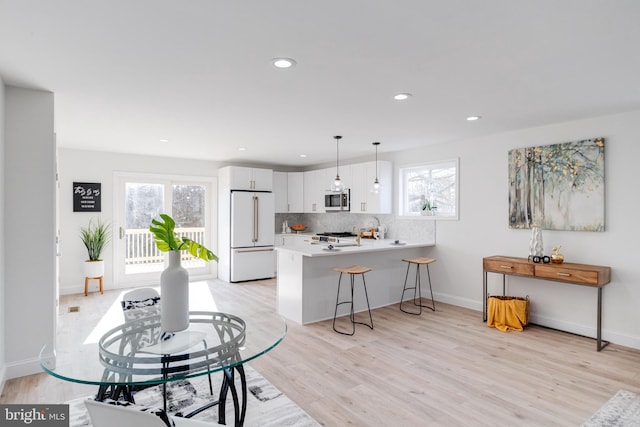 living room with light hardwood / wood-style floors