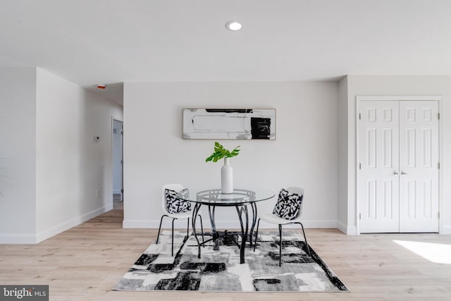 dining space with light wood-type flooring