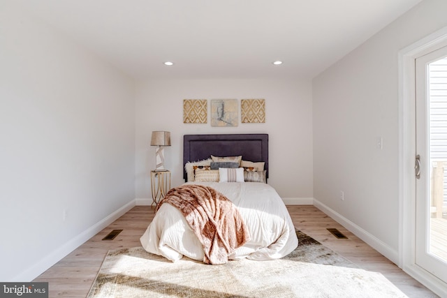 bedroom with light wood-type flooring