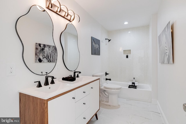 full bathroom featuring tiled shower / bath combo, vanity, and toilet