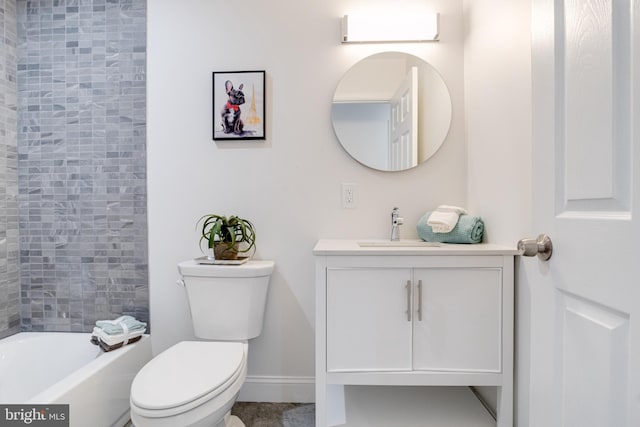 full bathroom with vanity, toilet, and tiled shower / bath combo