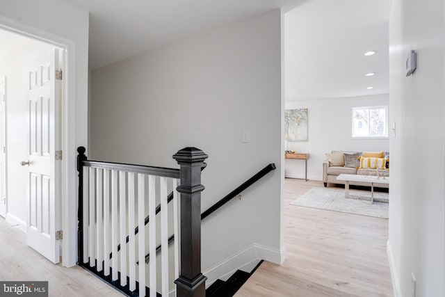 stairway featuring hardwood / wood-style floors