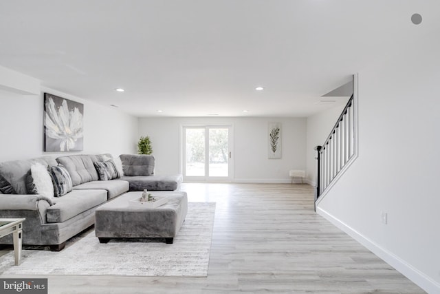 living room with light hardwood / wood-style flooring