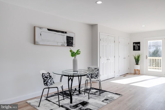 dining room with hardwood / wood-style flooring