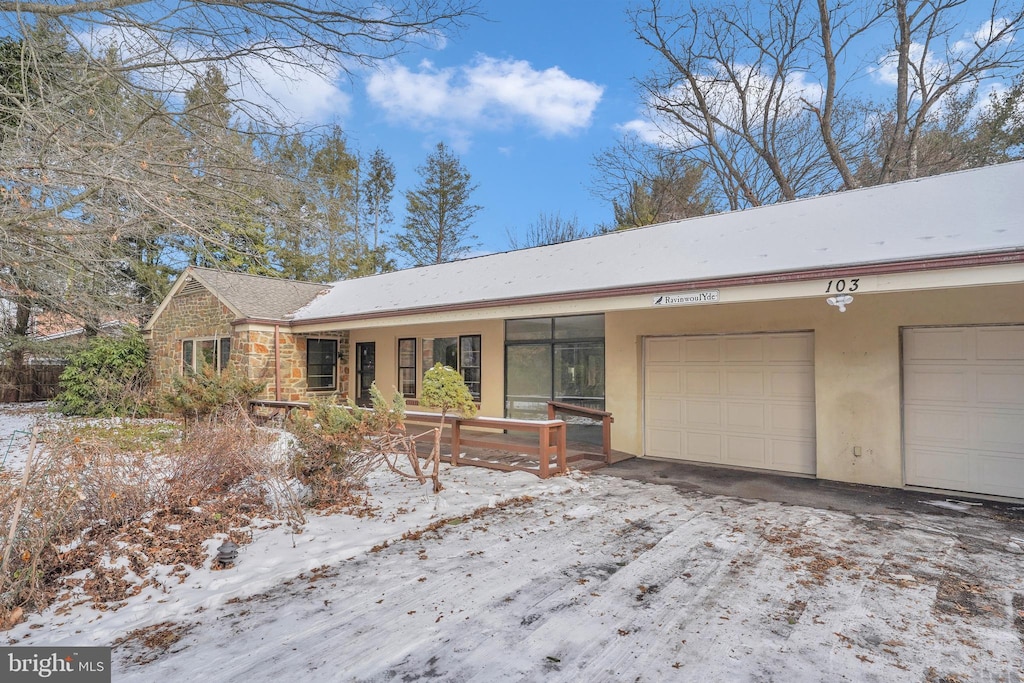 single story home with a garage