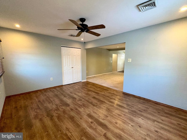 unfurnished room featuring hardwood / wood-style flooring and ceiling fan