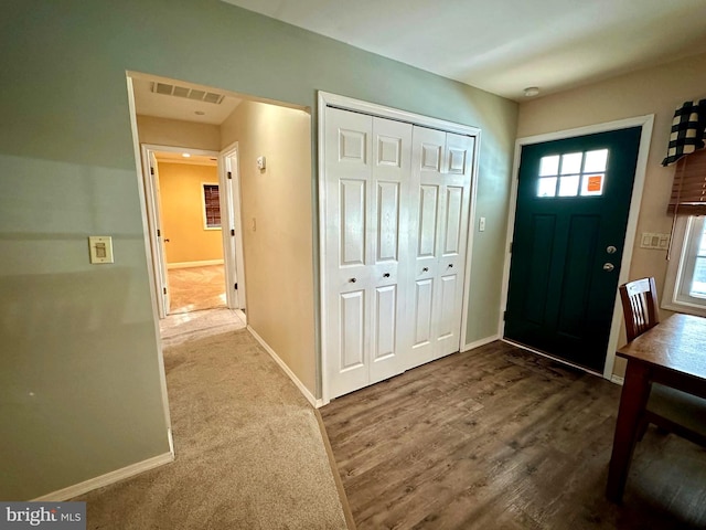 entrance foyer featuring carpet