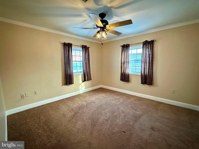 carpeted empty room featuring plenty of natural light, ceiling fan, and ornamental molding