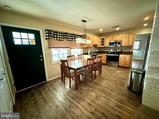 dining room featuring sink and dark hardwood / wood-style floors