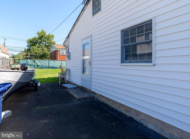 view of side of home featuring a lawn