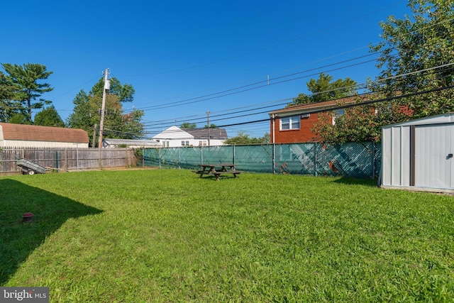 view of yard with a storage unit