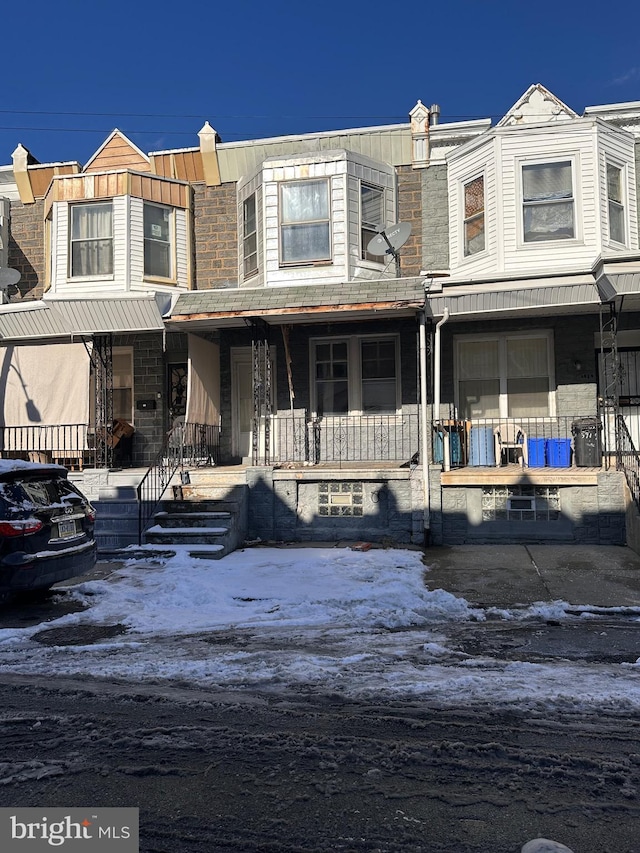 townhome / multi-family property with covered porch