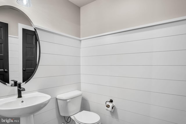 bathroom with sink and toilet