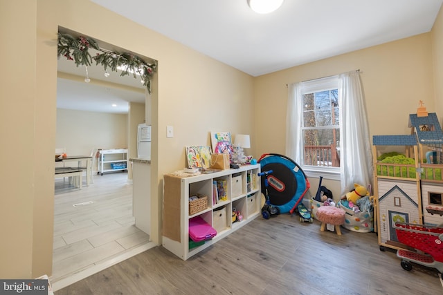 playroom with light wood-type flooring