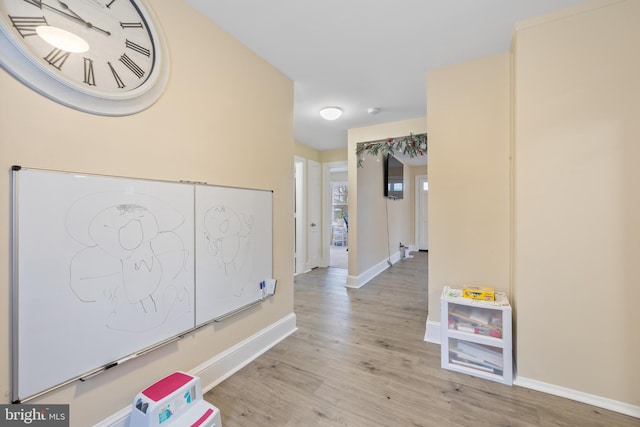 corridor featuring light hardwood / wood-style flooring