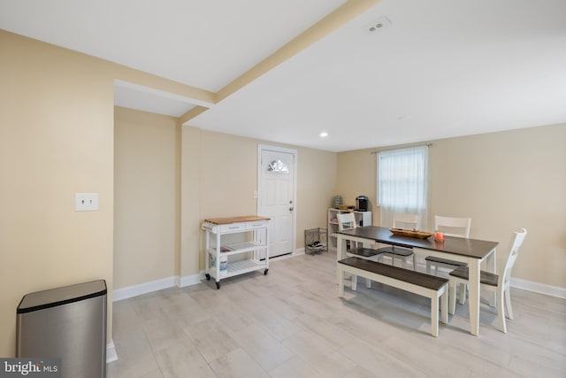 dining space with light wood-type flooring