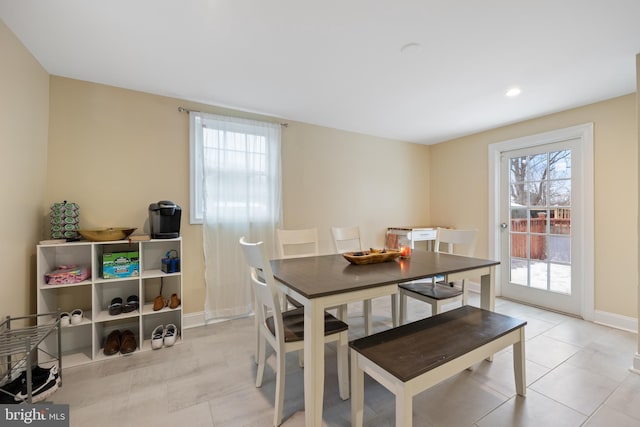 dining area featuring light tile patterned floors