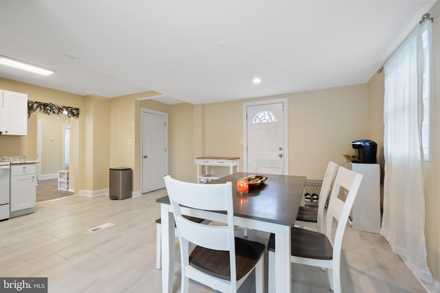 dining room with light wood-type flooring