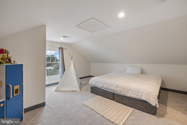 carpeted bedroom featuring vaulted ceiling