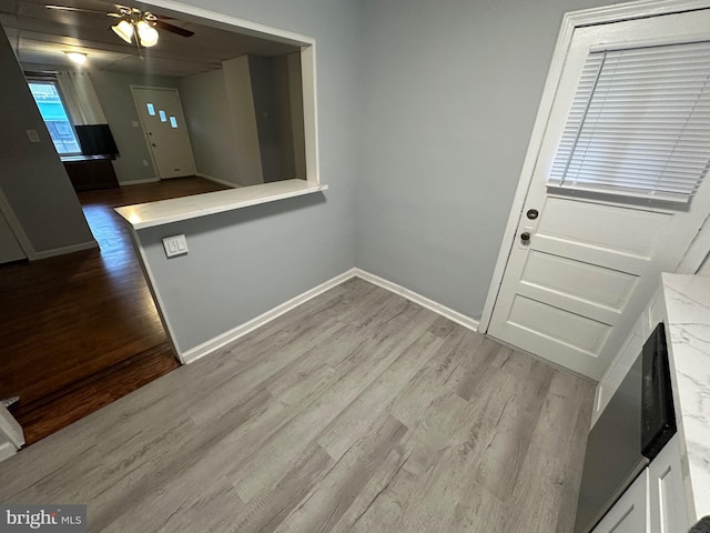 foyer entrance featuring ceiling fan and light hardwood / wood-style flooring