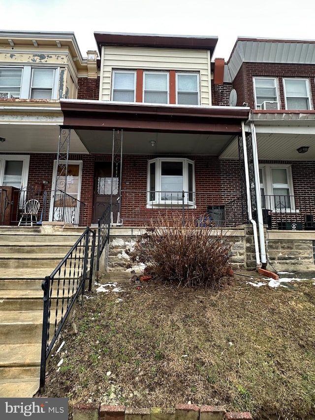 view of property with covered porch