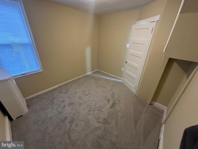 empty room with light colored carpet