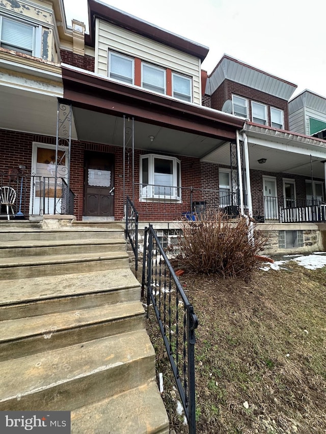 view of property with covered porch