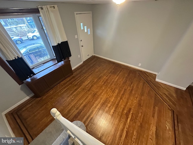 entrance foyer featuring dark hardwood / wood-style floors