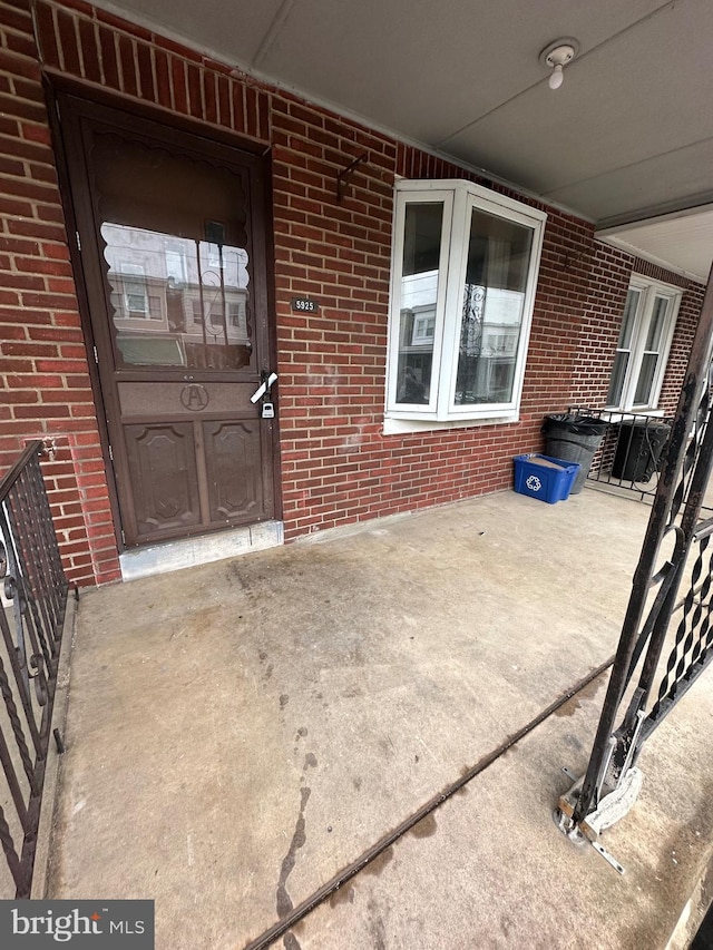 entrance to property featuring a patio