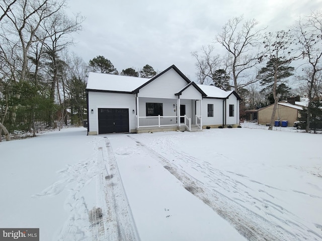 view of front of home with a porch and an attached garage