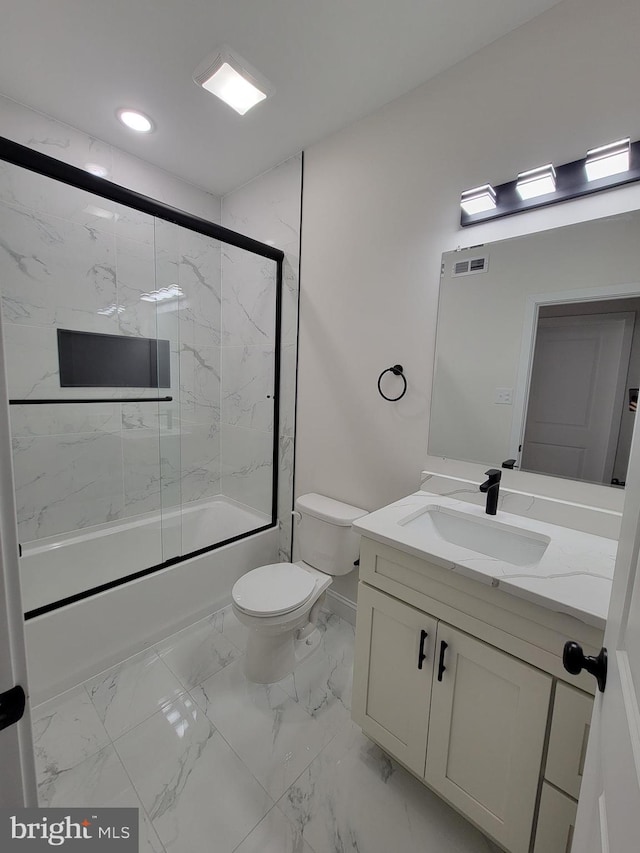 full bathroom with visible vents, toilet, enclosed tub / shower combo, marble finish floor, and vanity