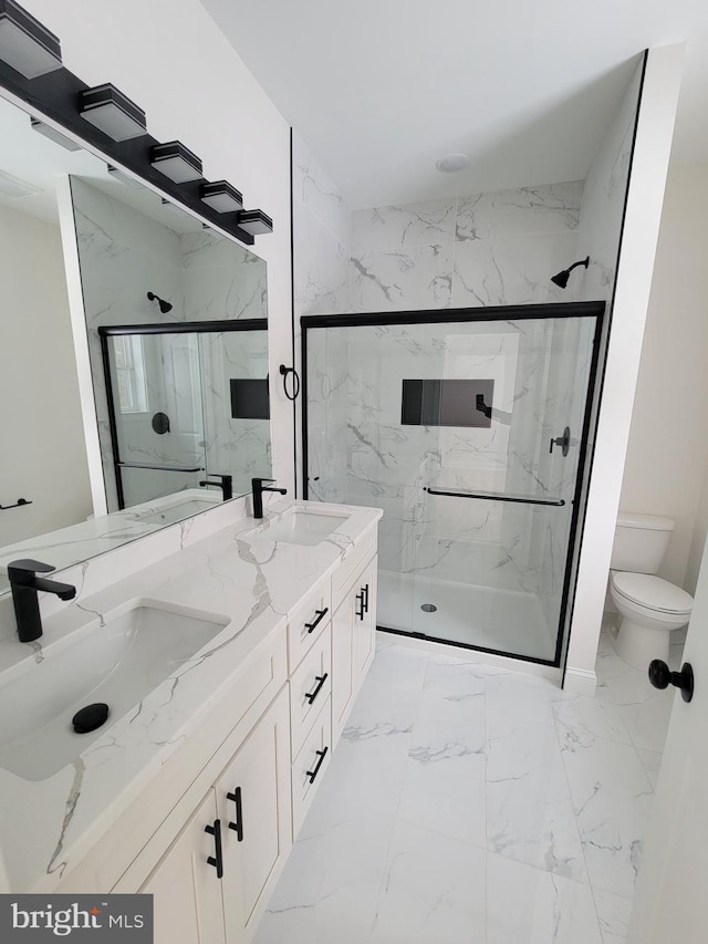 full bathroom with toilet, marble finish floor, a marble finish shower, and a sink