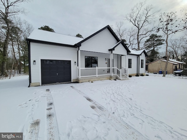 view of front facade featuring an attached garage and a porch