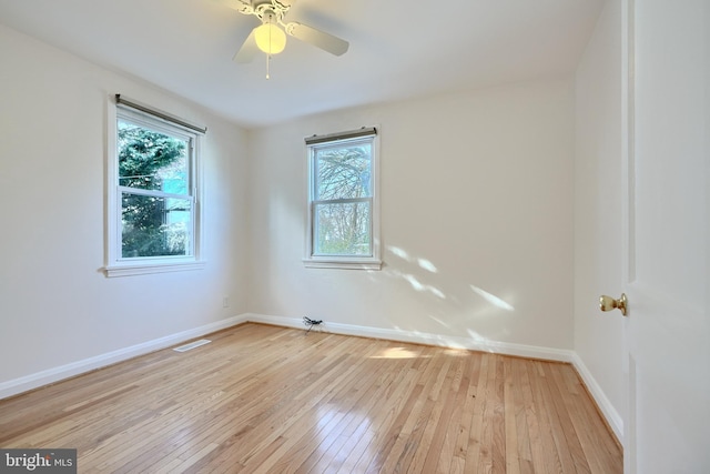 unfurnished room with ceiling fan and light hardwood / wood-style floors