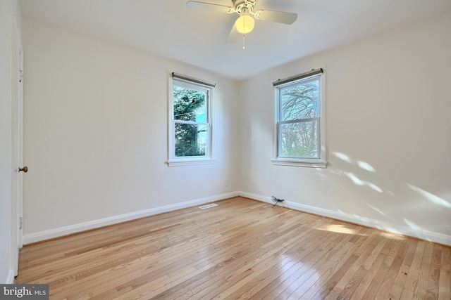 unfurnished room with ceiling fan and light hardwood / wood-style floors