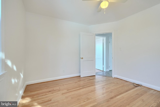 unfurnished room featuring ceiling fan and light hardwood / wood-style flooring