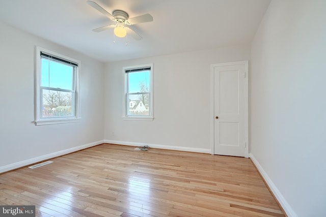 unfurnished room featuring ceiling fan and light wood-type flooring