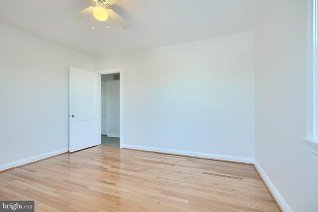 spare room with ceiling fan and light hardwood / wood-style floors