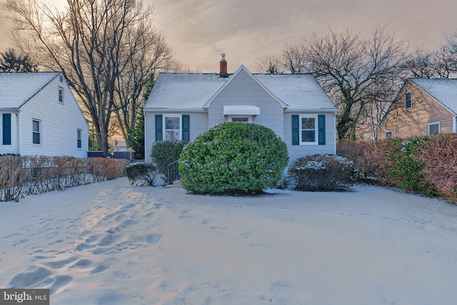 view of front of house featuring a chimney