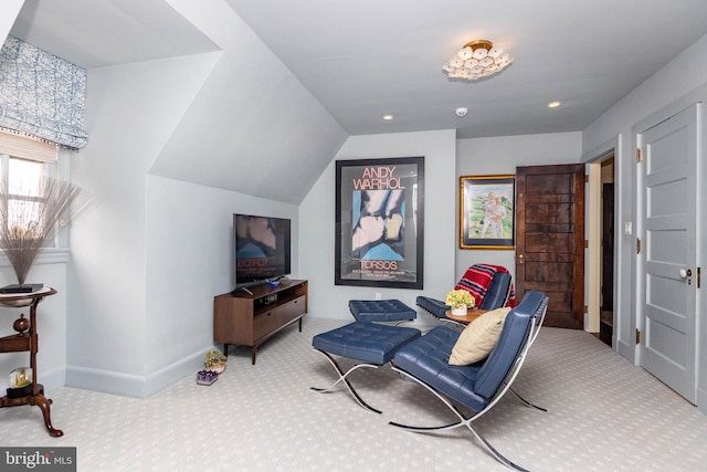 sitting room featuring carpet flooring, vaulted ceiling, baseboards, and recessed lighting