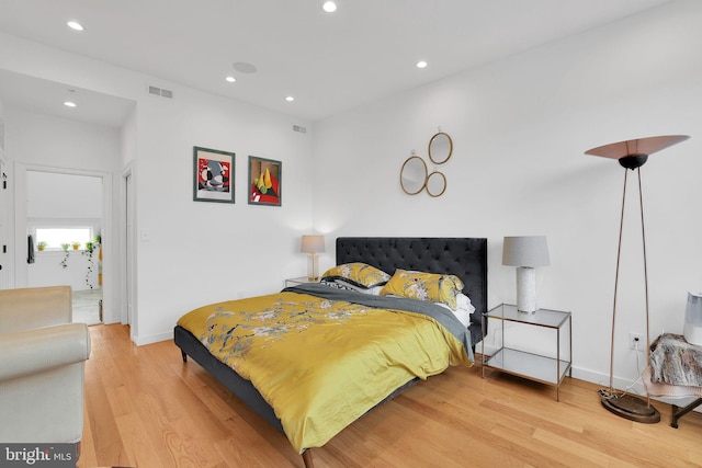 bedroom with hardwood / wood-style floors