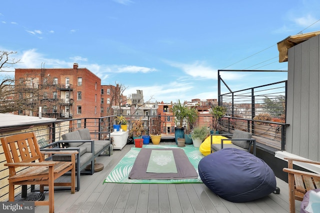 wooden deck with an outdoor hangout area