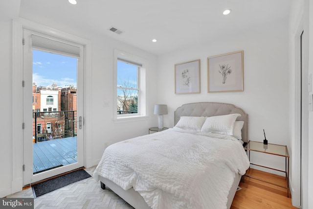 bedroom featuring access to outside and light wood-type flooring