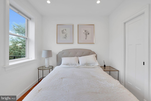 bedroom featuring dark hardwood / wood-style flooring