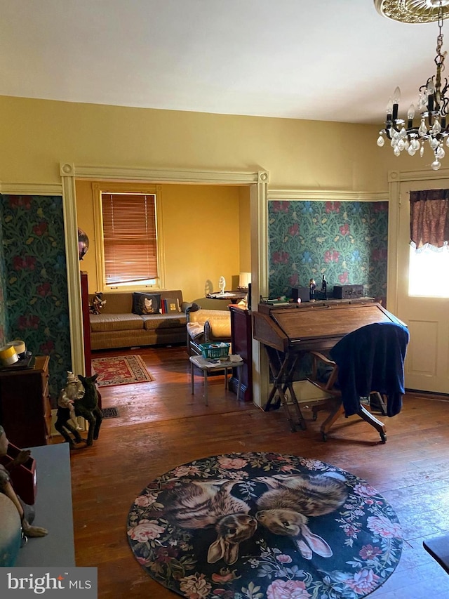 interior space featuring hardwood / wood-style floors and a notable chandelier