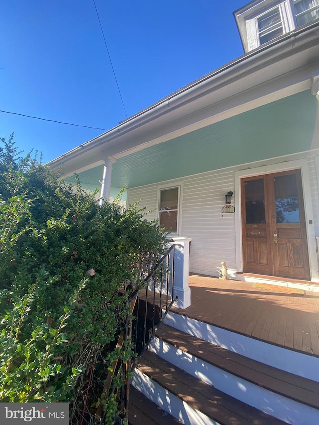 doorway to property with a porch