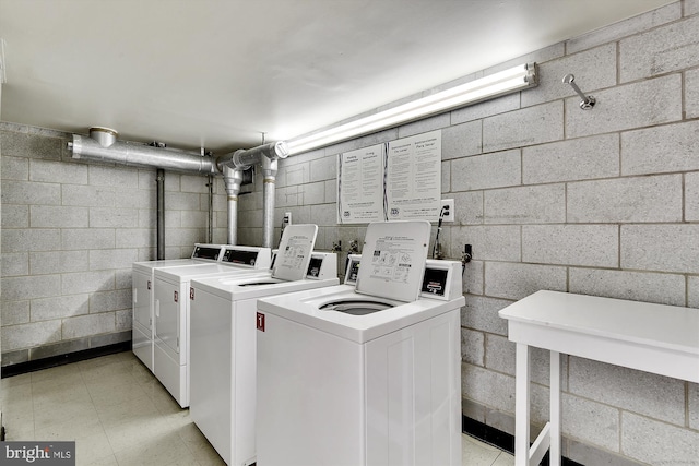 clothes washing area featuring washer and dryer